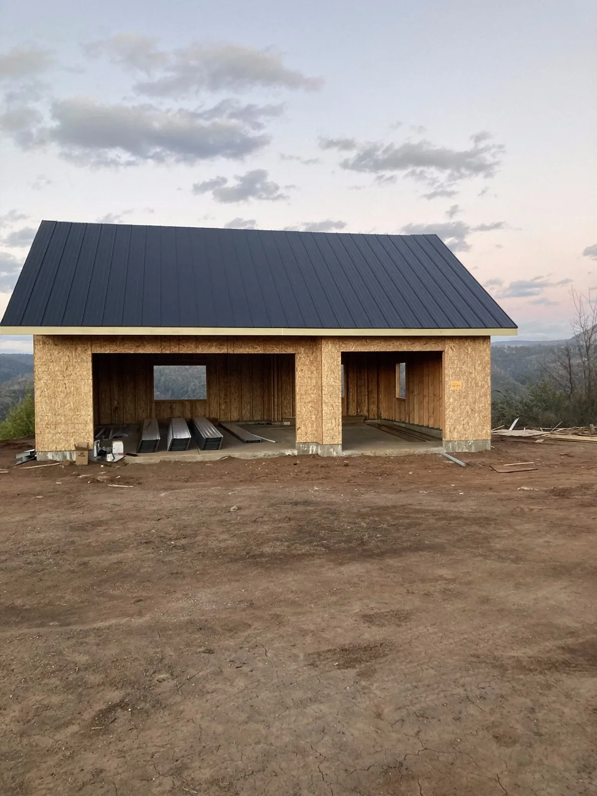 Standing-seam metal roof installed on new garage