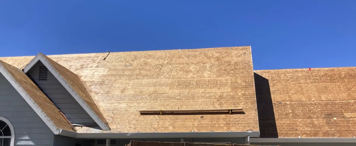 New plywood roof deck installed across gable and main roofline
